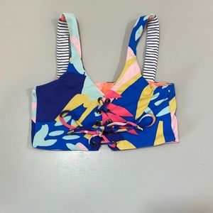 A reversible maaji swim top